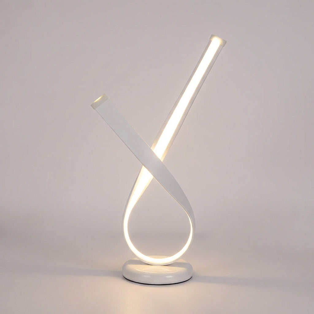 Skulpturale kompakte Tischlampe mit geschlungener Silhouette und Diffusor