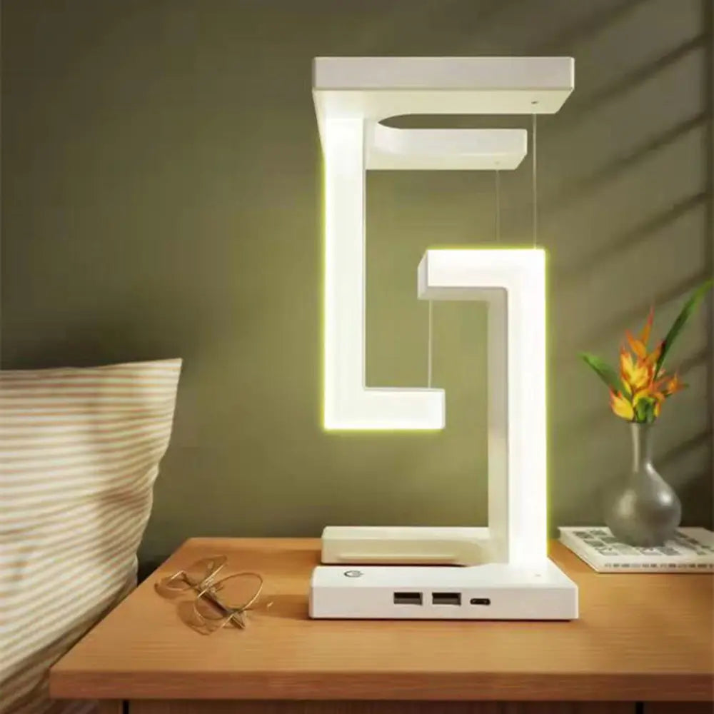 Bordlampe med svævende zonelys og trådløs opladning