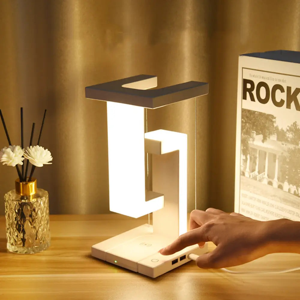 Bordlampe med svævende zonelys og trådløs opladning