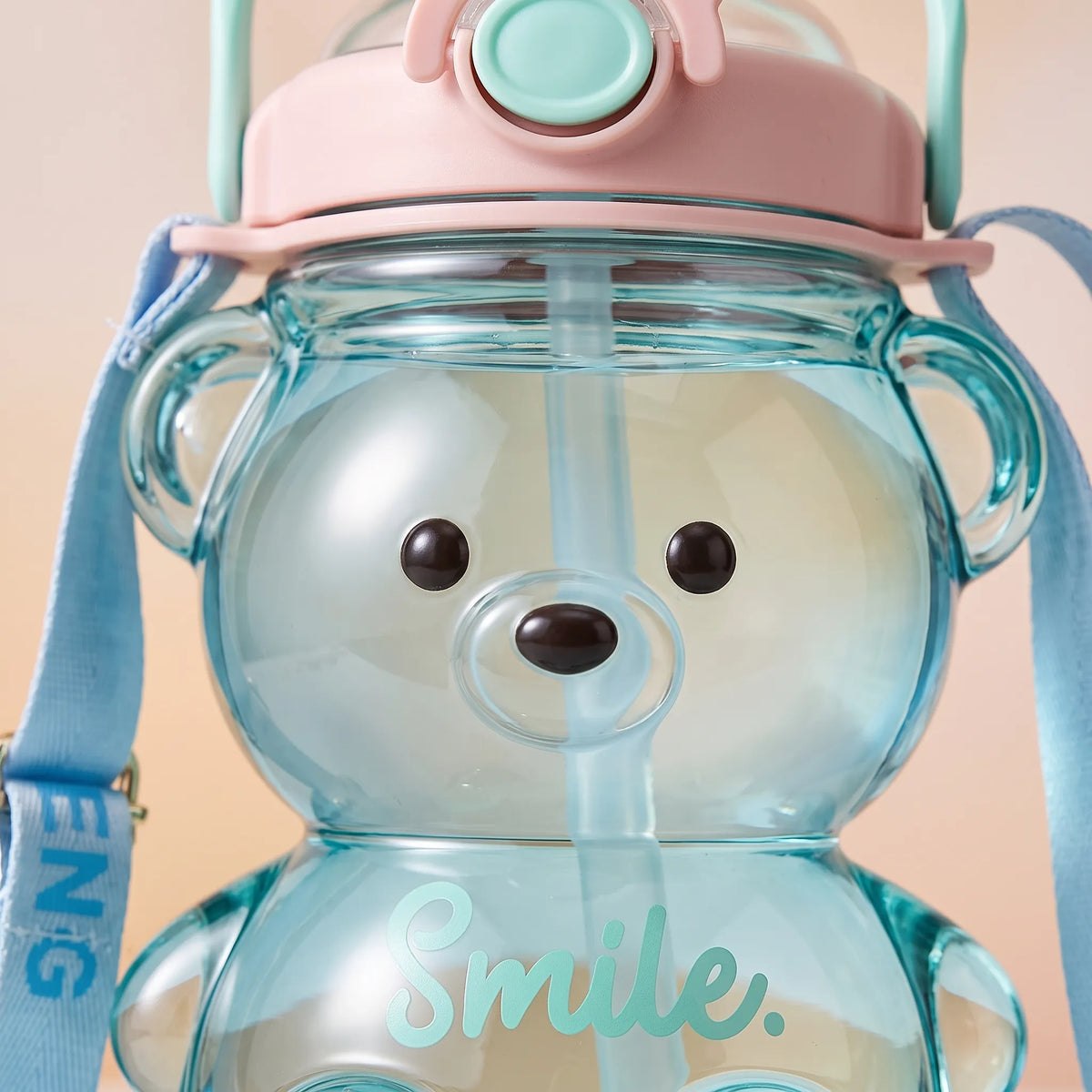 Verspielte transparente Kinder-Trinkflasche in Bärenform mit Tragegurt