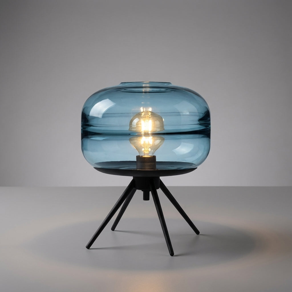 Skulpturale Tischlampe mit vierbeinigem Metallsockel und Glasschirm
