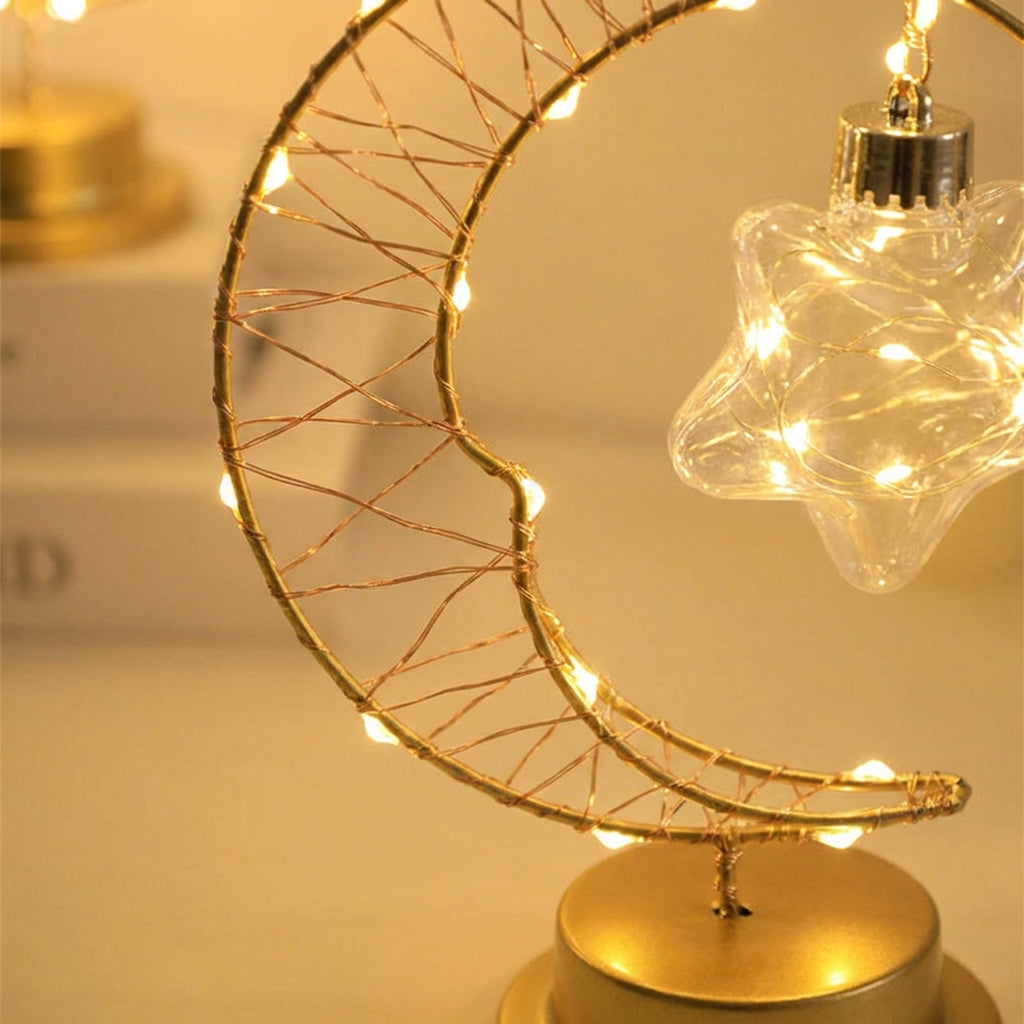 Dimm­bare Hängetischlampe mit geschwungener Mondsilhouette und gläsernem Stern