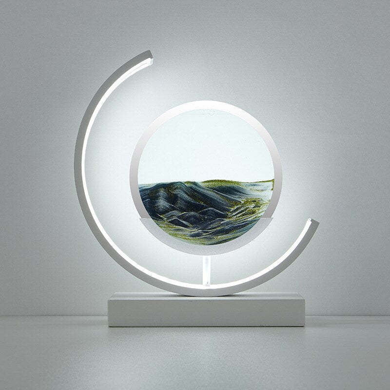 Tischlampe mit rotierender Sandkunst-Skulptur und stimmungsvoller Beleuchtung