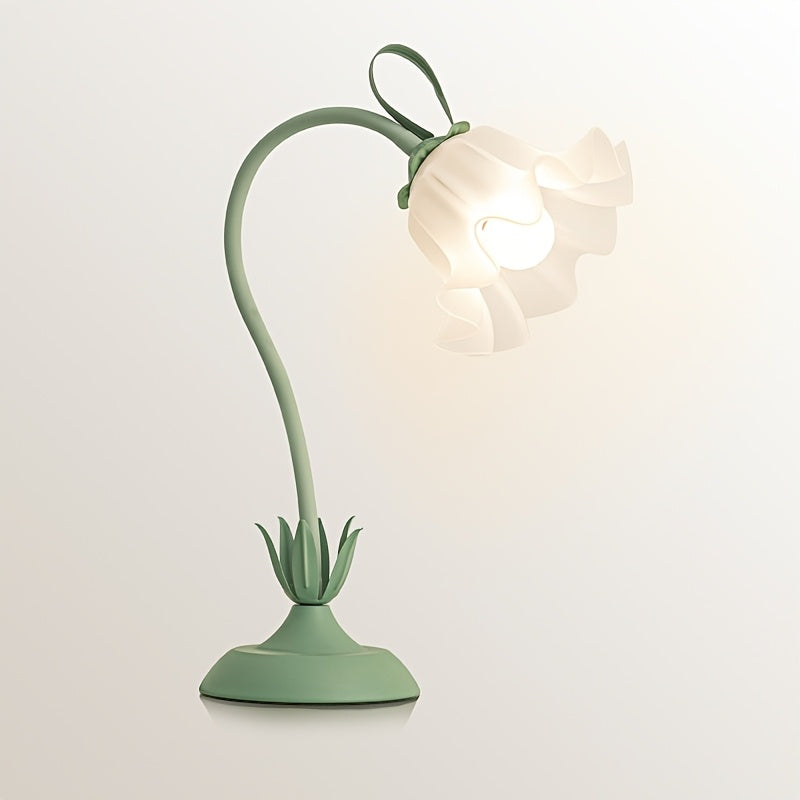 Skulpturel bordlampe i støbejern med blomsterskærm