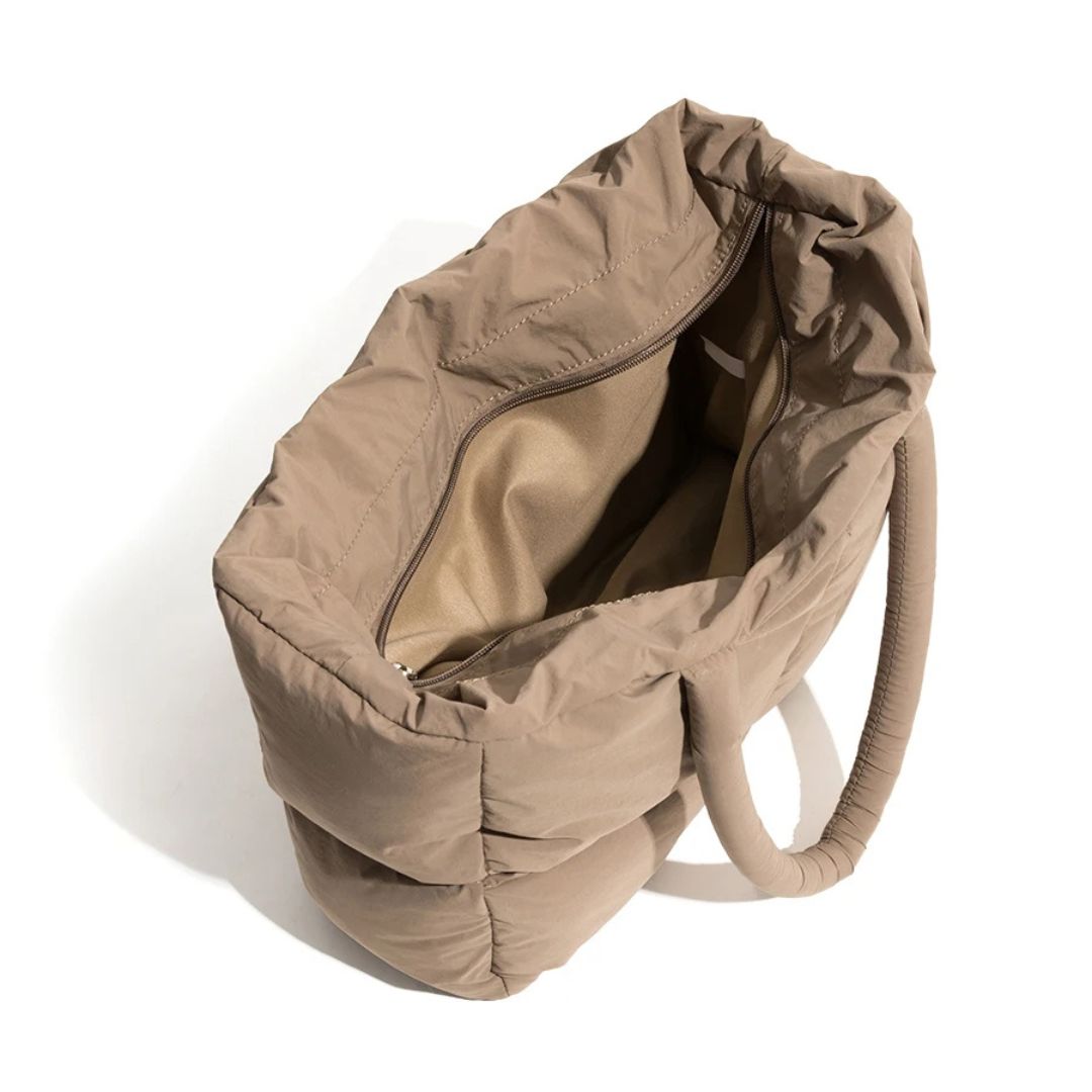 Vatteret, pufferdesignet skuldertaske i nylon med rummeligt laptoprum